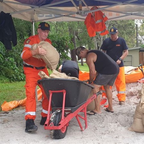 People filling sandbags