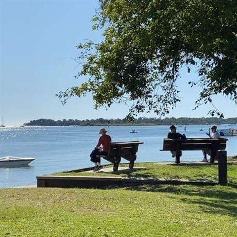 Picture of people sitting along the Noosaville foreshore