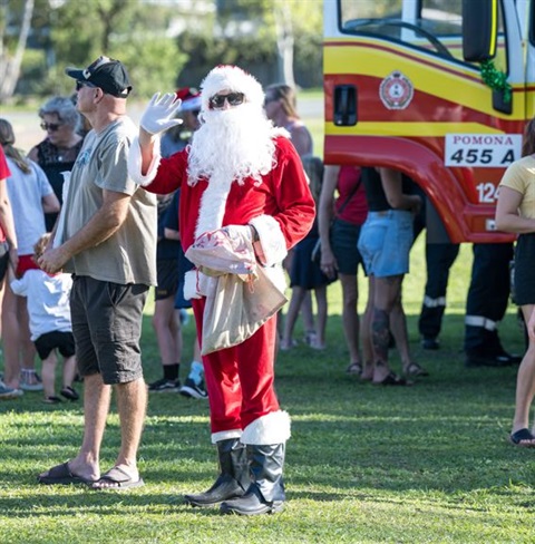 Santa next to Noosa Christmas Convoy