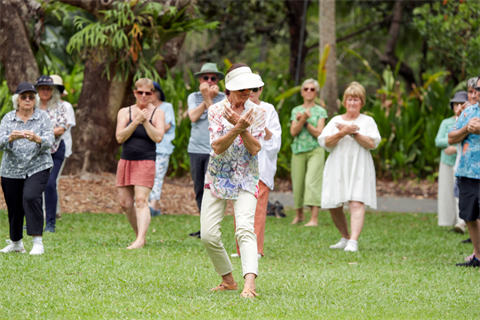 people practicing qi gong in gardens